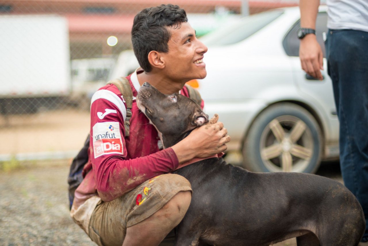 young_man_with_dog_in_costa_rica_hurricane_otto