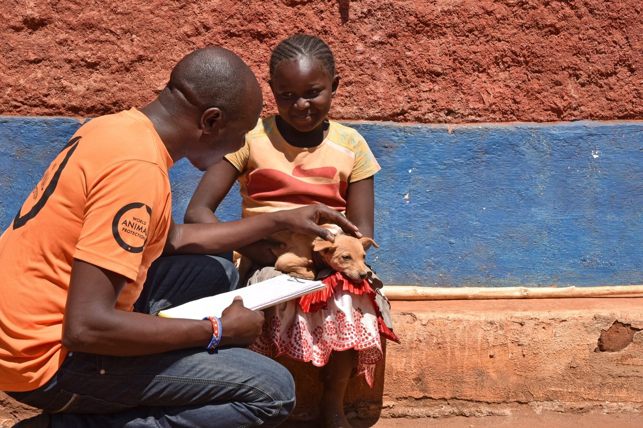 Jonathon Konuche talks to child who lost family to rabies